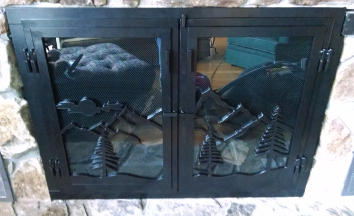 mountain motif fireplace doors: BradGreenwoodDesigns.com